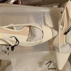 White kitten heel shoes